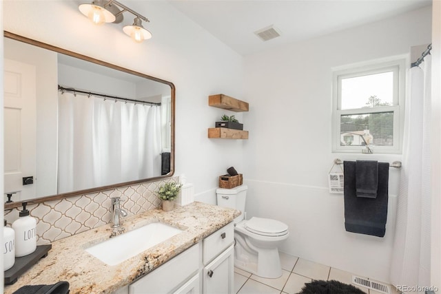 28364 Tresine Dr, Evergreen, CO 80439 - full bathroom featuring vanity, tile patterned floors, and decorative backsplash