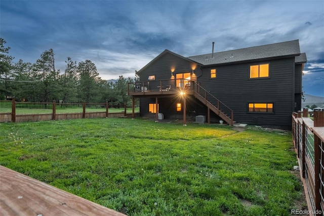 28364 Tresine Dr, Evergreen, CO 80439 - rear view of house featuring stairway, a wooden deck, a fenced backyard, and roof with shingles