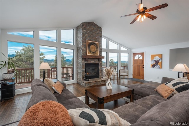 28364 Tresine Dr, Evergreen, CO 80439 - living room with high vaulted ceiling, a fireplace, ceiling fan, and wood finished floors