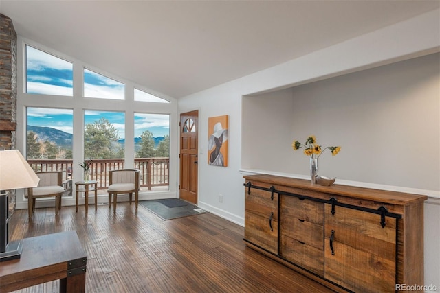 28364 Tresine Dr, Evergreen, CO 80439 - sitting room featuring lofted ceiling and dark wood-style flooring