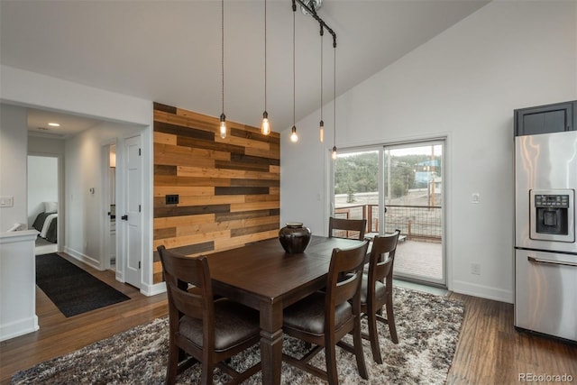 28364 Tresine Dr, Evergreen, CO 80439 - dining room with high vaulted ceiling, wood walls, and dark wood-style floors