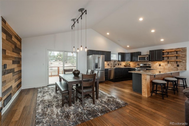 28364 Tresine Dr, Evergreen, CO 80439 - dining room featuring high vaulted ceiling, dark wood finished floors, and recessed lighting