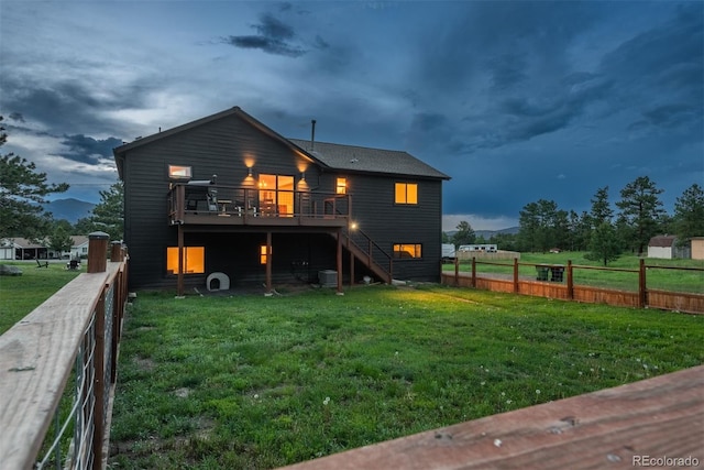 28364 Tresine Dr, Evergreen, CO 80439 - back of property with a wooden deck and stairway