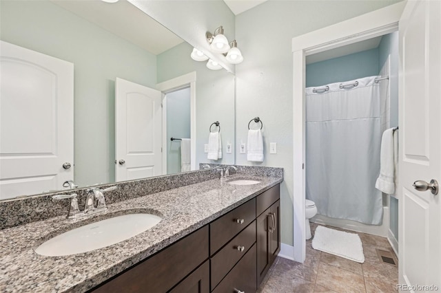11346 E 27th Ave, Denver, CO 80238 - bathroom featuring double vanity, a shower with curtain, toilet, and baseboards