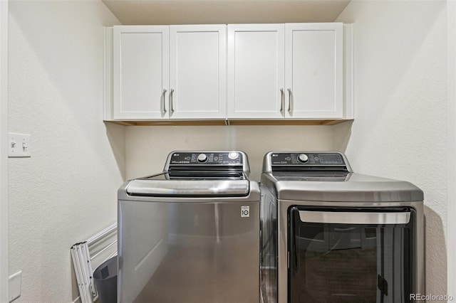 11346 E 27th Ave, Denver, CO 80238 - clothes washing area featuring washing machine and dryer and cabinet space