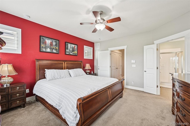 11346 E 27th Ave, Denver, CO 80238 - bedroom with light carpet, baseboards, ceiling fan, and connected bathroom