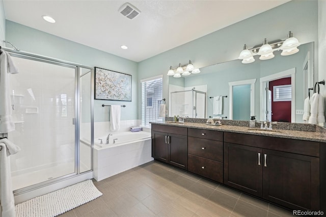 11346 E 27th Ave, Denver, CO 80238 - full bath featuring a shower stall, a garden tub, and double vanity