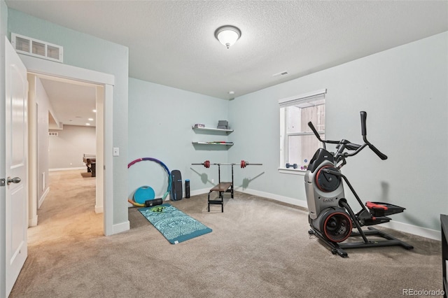 11346 E 27th Ave, Denver, CO 80238 - exercise area featuring carpet floors, a textured ceiling, and baseboards