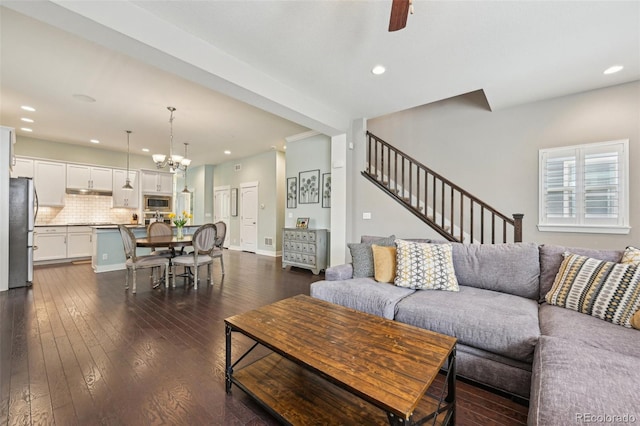 11346 E 27th Ave, Denver, CO 80238 - living room featuring recessed lighting, dark wood-style flooring, stairway, a chandelier, and a ceiling fan