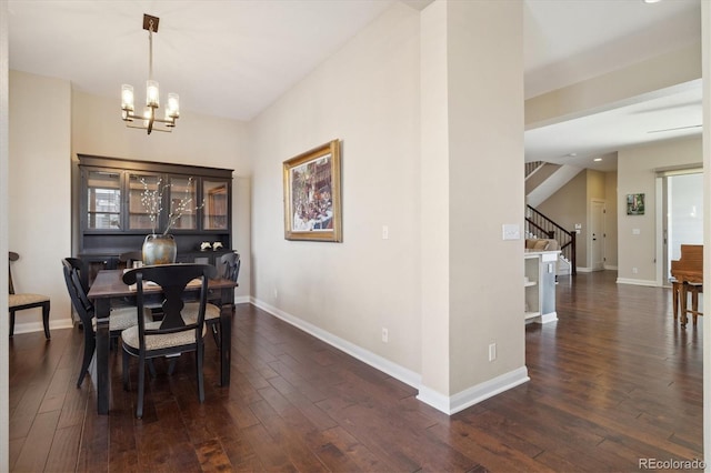 1950 W 67th Ave, Denver, CO 80221 - dining area featuring dark wood-style flooring, baseboards, an inviting chandelier, and stairs