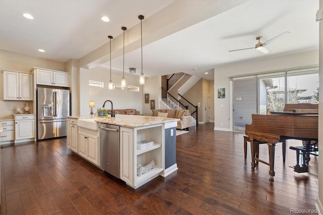 1950 W 67th Ave, Denver, CO 80221 - kitchen with open floor plan, pendant lighting, appliances with stainless steel finishes, and dark wood-style flooring