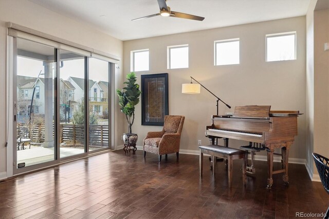 1950 W 67th Ave, Denver, CO 80221 - living area featuring wood finished floors, ceiling fan, baseboards, and plenty of natural light