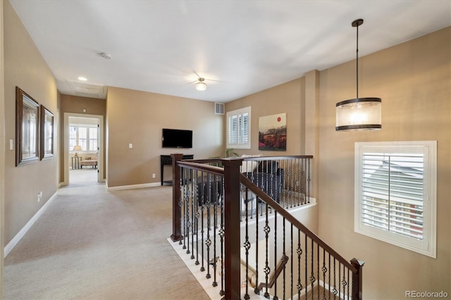 1950 W 67th Ave, Denver, CO 80221 - hall featuring visible vents, light carpet, attic access, an upstairs landing, and baseboards