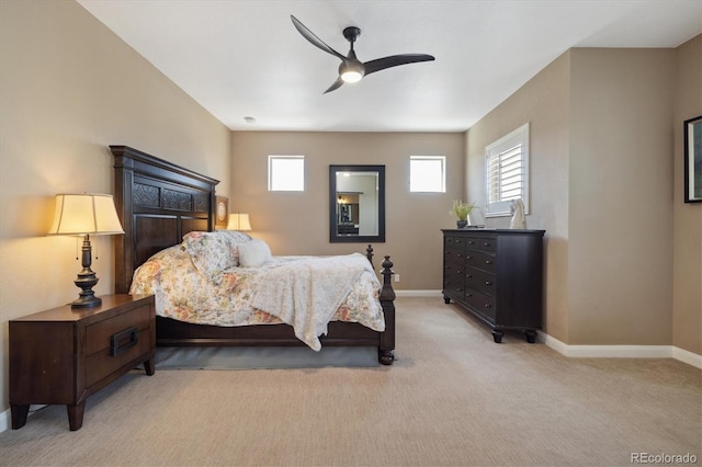 1950 W 67th Ave, Denver, CO 80221 - carpeted bedroom with baseboards, multiple windows, and ceiling fan