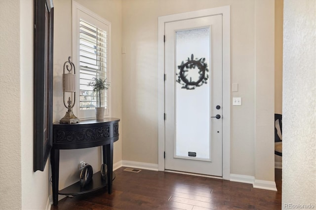 1950 W 67th Ave, Denver, CO 80221 - foyer featuring plenty of natural light, dark wood-type flooring, and baseboards