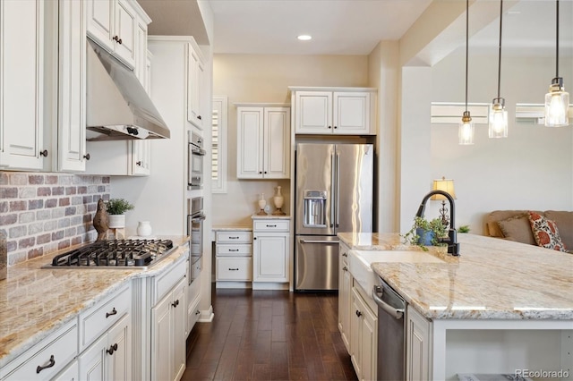 1950 W 67th Ave, Denver, CO 80221 - kitchen with white cabinets, under cabinet range hood, dark wood finished floors, stainless steel appliances, and a sink