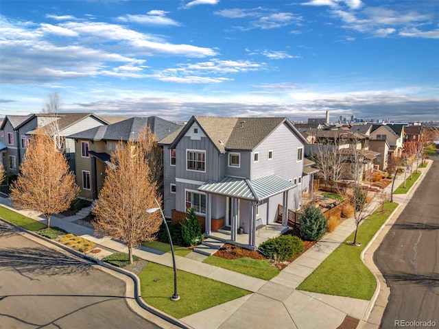 1950 W 67th Ave, Denver, CO 80221 - view of front of property featuring board and batten siding, a front lawn, and a residential view