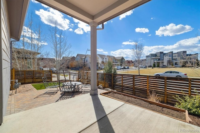 1950 W 67th Ave, Denver, CO 80221 - view of patio / terrace featuring outdoor dining area, fence, and a residential view