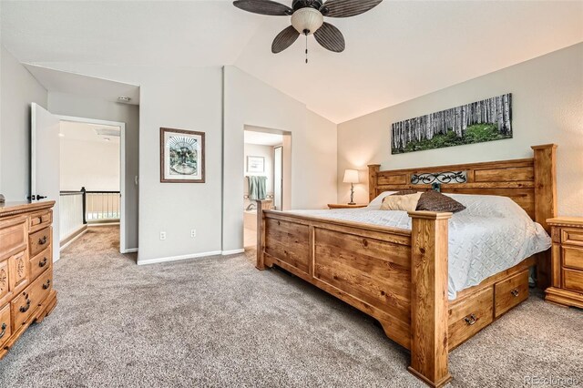 11522 Pine Grove Ln, Parker, CO 80138 - bedroom featuring vaulted ceiling, light colored carpet, baseboards, connected bathroom, and a ceiling fan