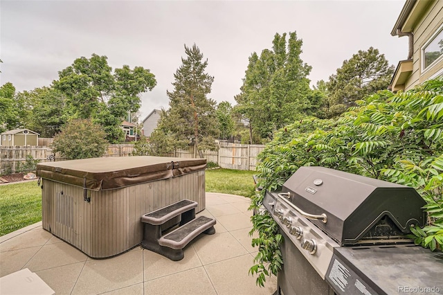 11522 Pine Grove Ln, Parker, CO 80138 - fenced backyard featuring a hot tub, area for grilling, and a patio area