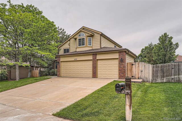 11522 Pine Grove Ln, Parker, CO 80138 - traditional-style house featuring concrete driveway and brick siding