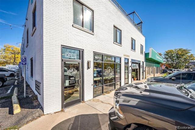 exterior space featuring brick siding