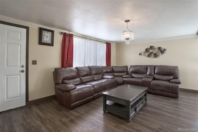 living room with a textured ceiling, baseboards, and dark wood-style flooring