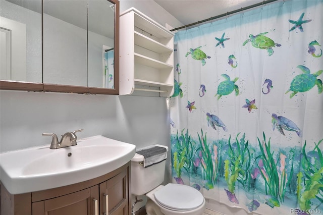 full bath featuring shower / tub combo, toilet, and vanity