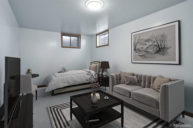 bedroom featuring light carpet and baseboards