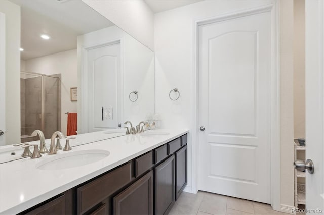 bathroom with vanity, tile patterned floors, and walk in shower