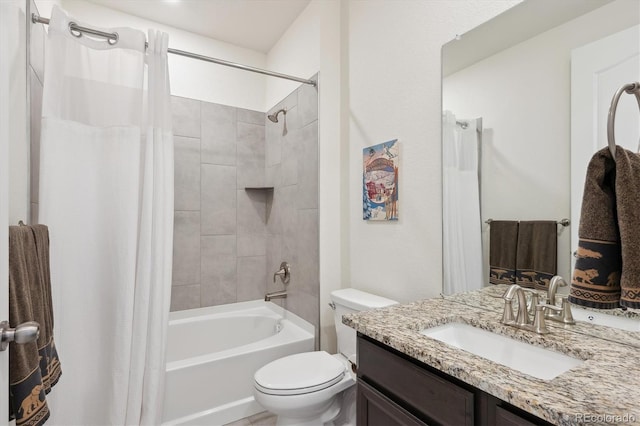 full bathroom with vanity, shower / bath combo, and toilet