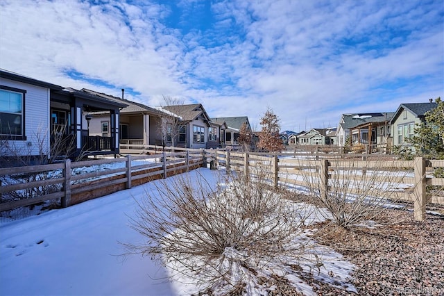 view of yard covered in snow