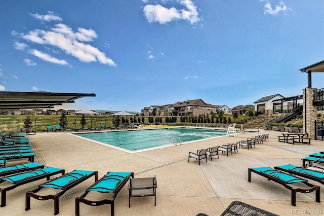 view of swimming pool with a patio