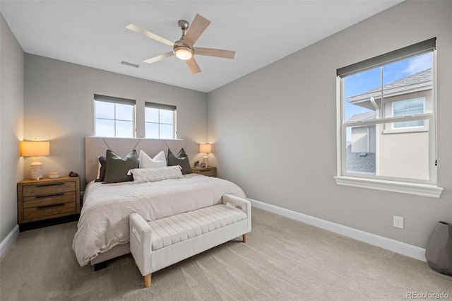 6737 S White Crow Way, Aurora, CO 80016 - bedroom featuring multiple windows, light colored carpet, and ceiling fan