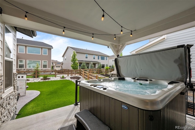 6737 S White Crow Way, Aurora, CO 80016 - view of patio / terrace featuring a hot tub and a residential view