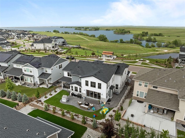 6737 S White Crow Way, Aurora, CO 80016 - aerial perspective of suburban area featuring a large body of water