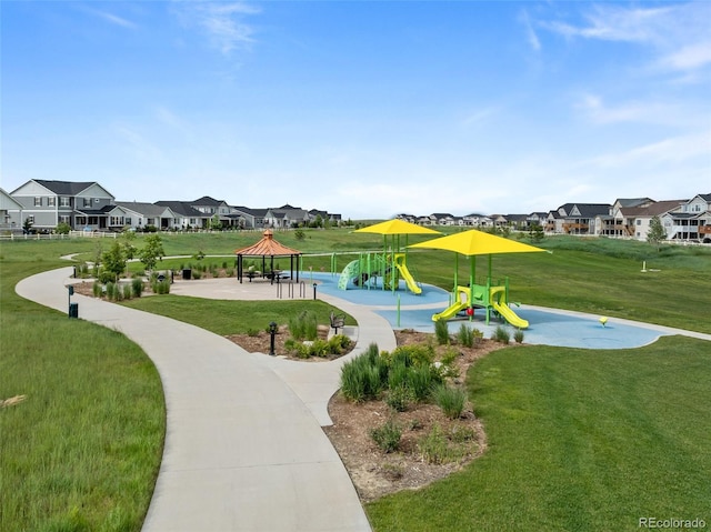 6737 S White Crow Way, Aurora, CO 80016 - view of community with a gazebo, a residential view, and a lawn