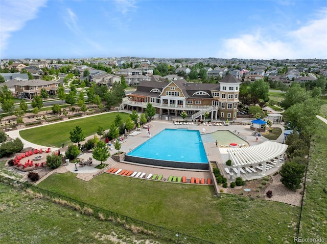 6737 S White Crow Way, Aurora, CO 80016 - community pool with a patio, a lawn, and a residential view