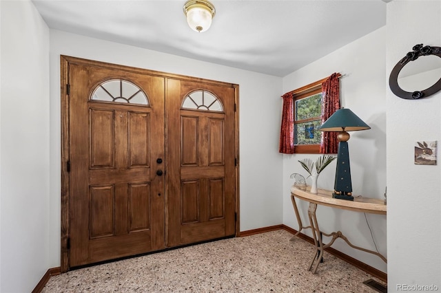 entryway with light floors, visible vents, and baseboards