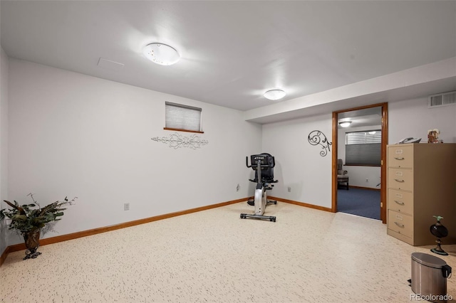 workout area featuring visible vents and baseboards