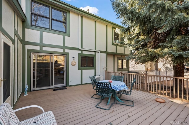 wooden deck with outdoor dining space