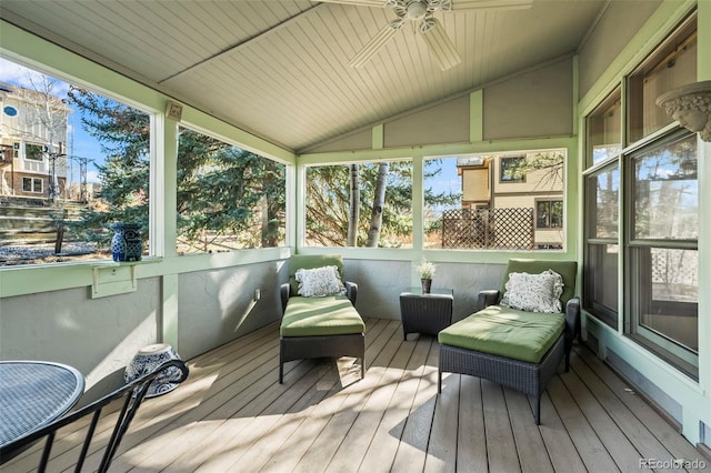 sunroom / solarium featuring lofted ceiling and ceiling fan