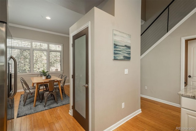 880 E 16th Ave Unit D, Denver, CO 80218 - dining space featuring light wood-style floors, baseboards, ornamental molding, and recessed lighting