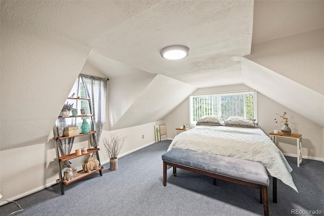 carpeted bedroom featuring a textured ceiling, multiple windows, and lofted ceiling