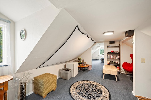 bonus room with a wealth of natural light, carpet floors, and vaulted ceiling