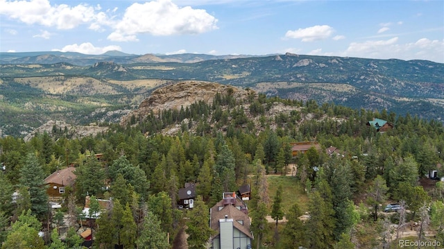 birds eye view of property with a mountain view