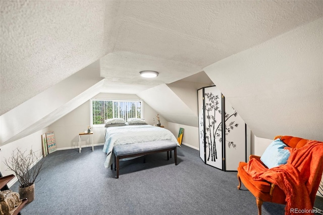 bedroom featuring lofted ceiling, carpet, and a textured ceiling