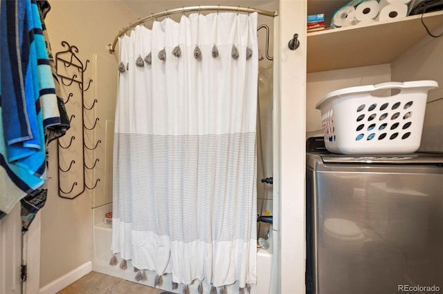 washroom featuring washer / clothes dryer and light tile patterned floors