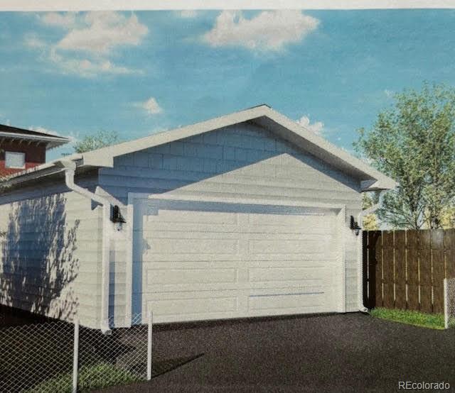 view of home's exterior with a garage and fence