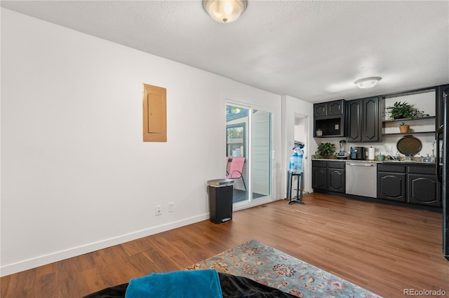 8820 Poze Blvd, Thornton, CO 80229 - kitchen with stainless steel dishwasher, electric panel, open shelves, wood finished floors, and a textured ceiling